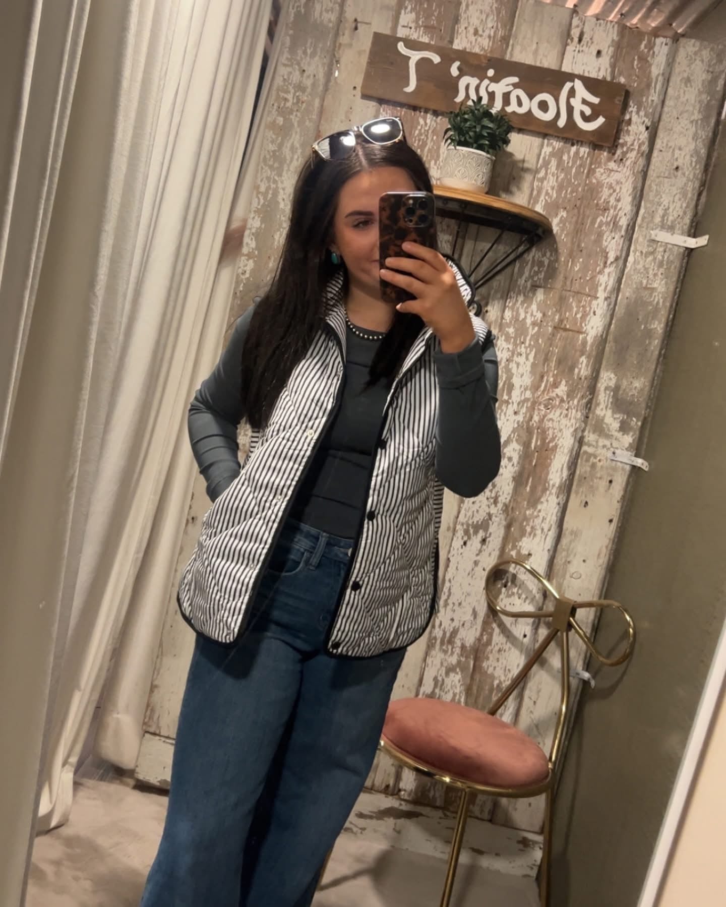 Black and White Striped Puffer Vest with Pockets. 