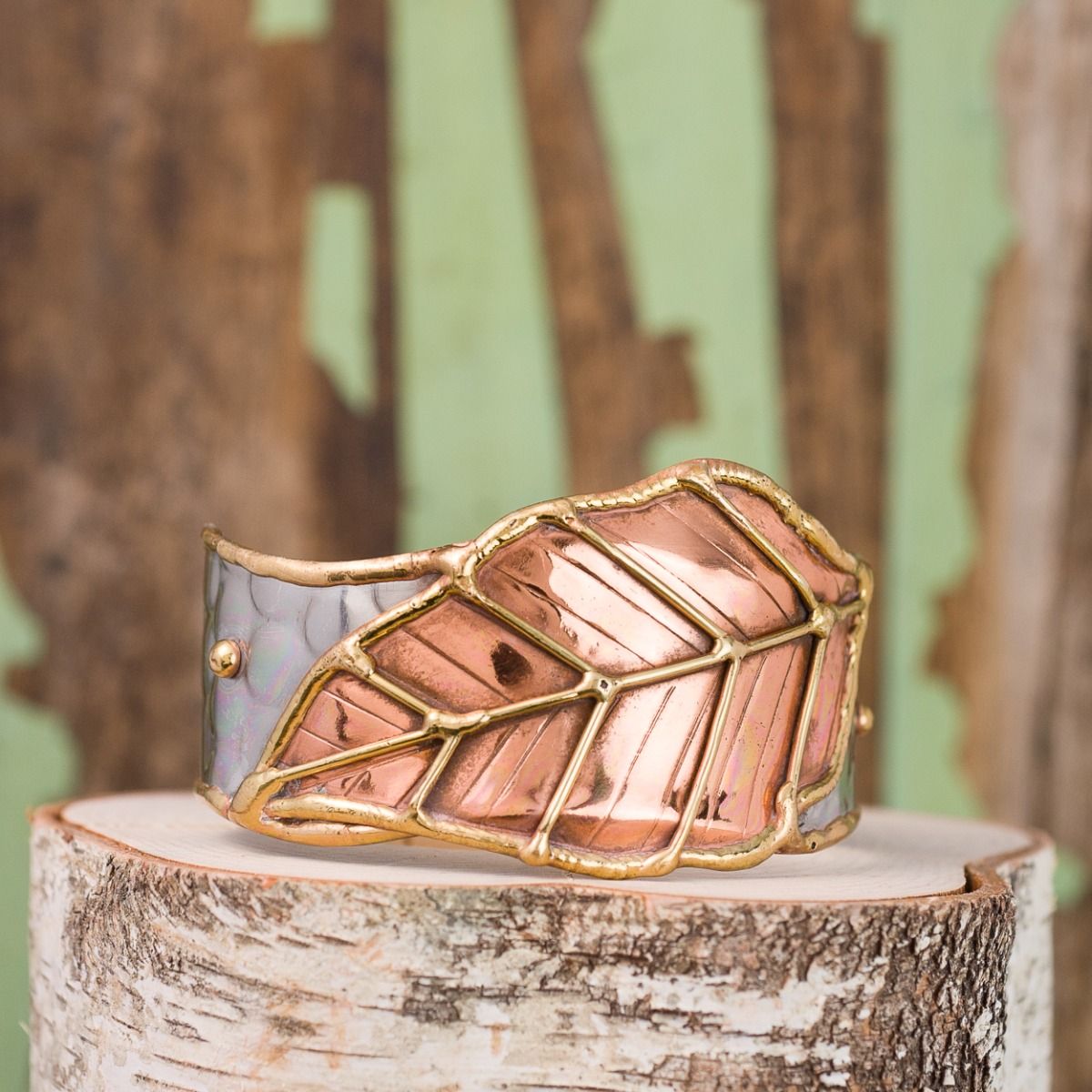 Anju Stainless Steel Cuff with brass and copper scroll-work