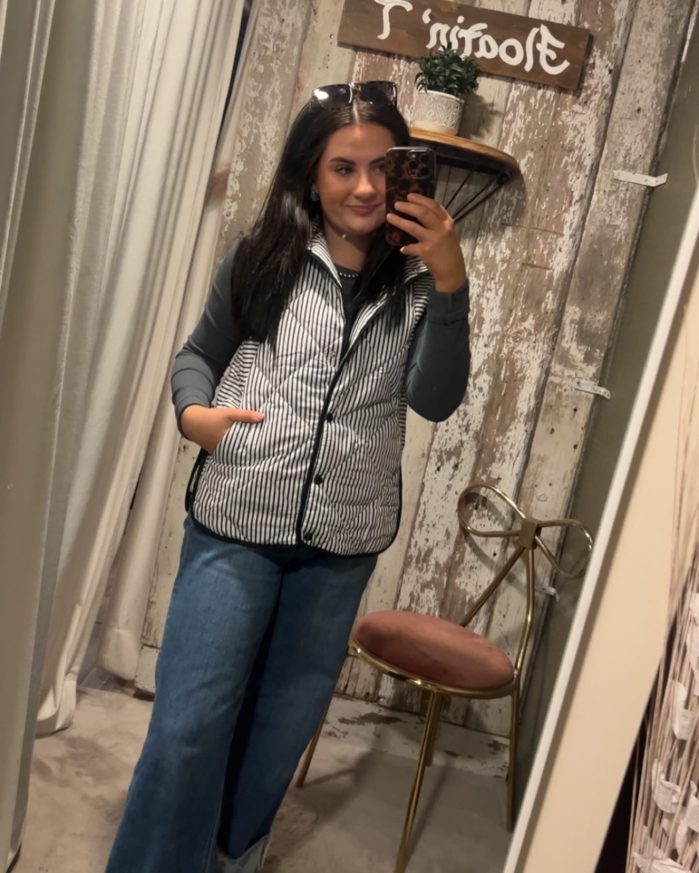 Black and White Striped Puffer Vest with Pockets. ￼