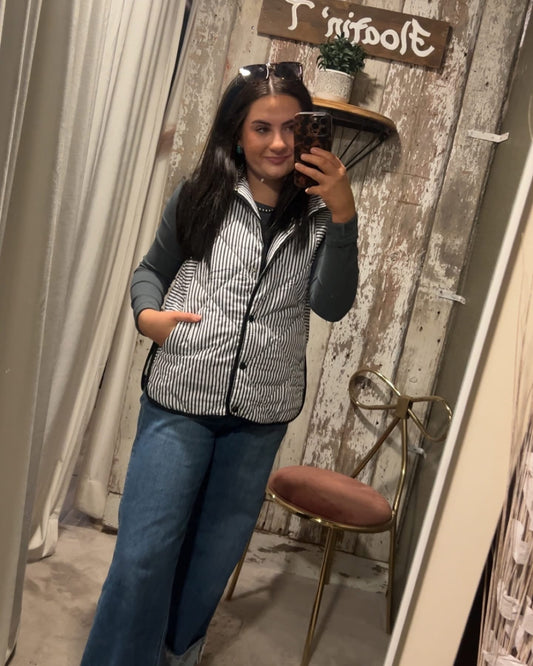 Black and White Striped Puffer Vest with Pockets. ￼