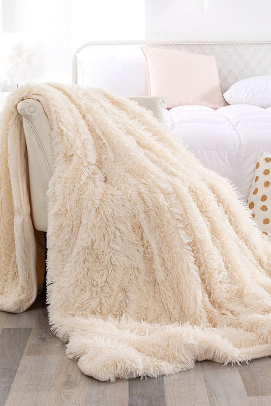 Plush white fuzzy blanket